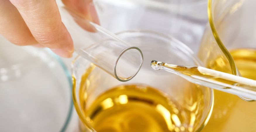 cbd-oil-dropping-from-pipette-into-test-tube.jpg