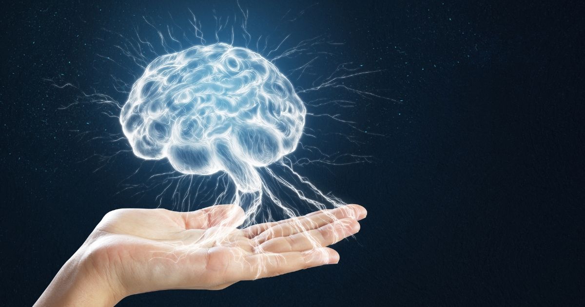 image of hand holding a hologram of a brain