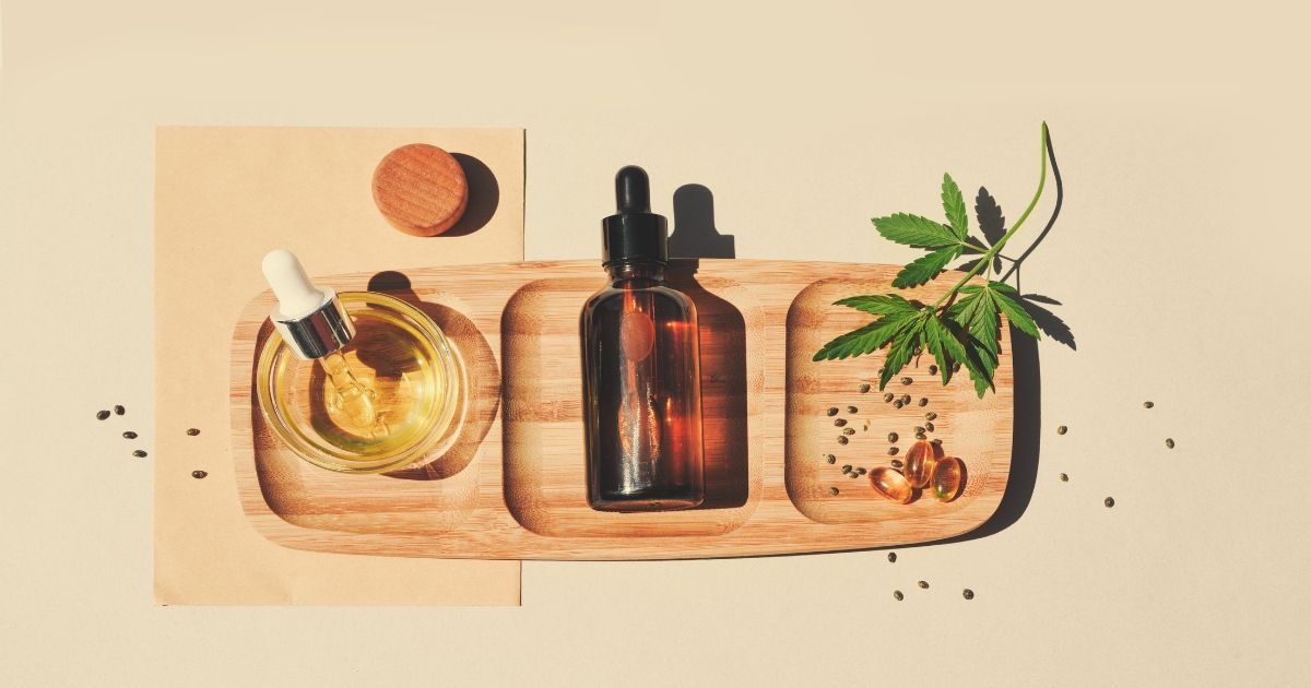 variety of cbd products on a wooden tray