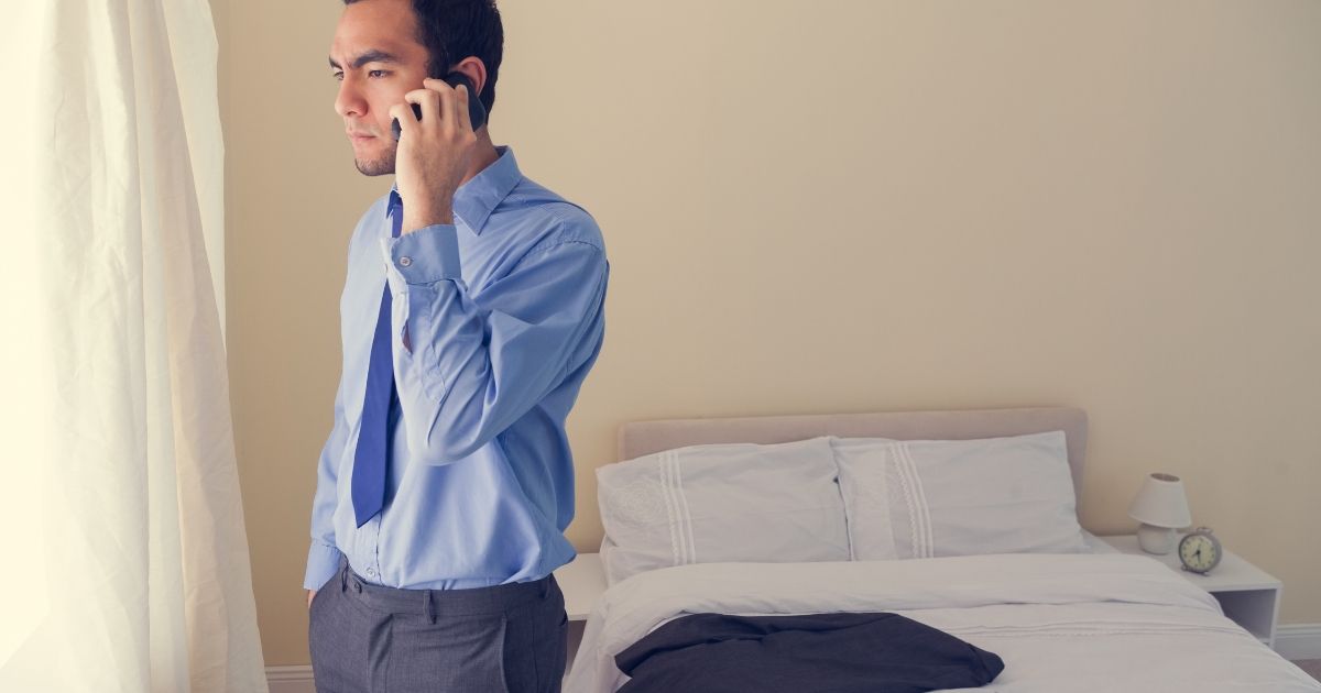 man looking distressed while calling someone on phone
